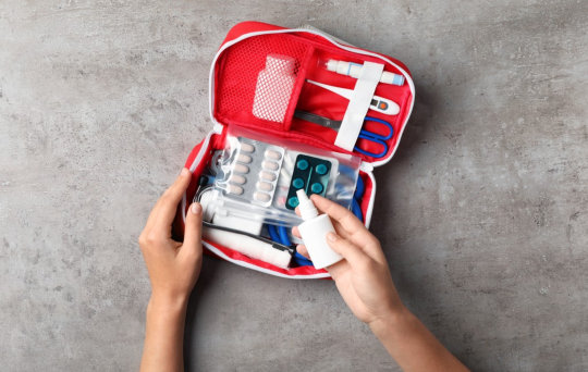 image of a first aid kit in a red bag