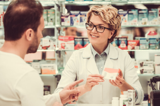 image og pharmacist explaining the medicine to the customer