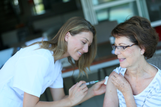 image of senior woman having her vaccination